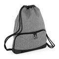 Introducing the Bagbase BG542: a heathered grey backpack featuring black trim and dual zipper pockets on the front. The design includes black drawstring shoulder straps and a rounded bottom edge for added style.