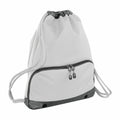 The Bagbase BG542 is a gray drawstring backpack featuring black adjustable strings, a zippered front pocket, and small black grommets at the bottom corners for enhanced durability, all set against a white background.