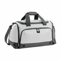 Introducing the Bagbase BG544: a stylish duffel bag showcasing a sleek white body with striking dark green accents. It includes a spacious zippered main compartment, a front pocket with dual zippers, a padded carrying handle, and an adjustable shoulder strap for added convenience. The design is both simple and functional.