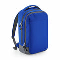 Introducing the Bagbase BG545: This stylish backpack features a blue design with a gray base and zippers, complete with adjustable shoulder straps and a convenient top handle.