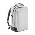 Introducing the BG545 by Bagbase: a sleek and minimalist light gray backpack accented with black zippers and a convenient handle. It comes equipped with padded shoulder straps for comfort and includes a small external pocket for easy access. The design embodies modern simplicity, making it perfect for any occasion.