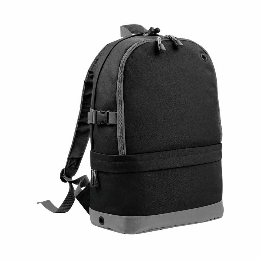 The BG550 backpack by Bagbase, featuring two main compartments, adjustable shoulder straps, and a top carry handle in black and gray, is set against a white background.