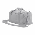 Introducing the Bagbase BG560, a sleek and functional light gray duffel bag featuring multiple zippered compartments, a shoulder strap, and double handles. Perfect for travel or sports adventures.