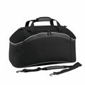 Bagbase's BG572 is a black duffel bag featuring a zipper, handles, and a detachable shoulder strap.