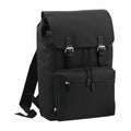 The Bagbase BG613 backpack features a black design with a flap cover, buckle closures, and a front zippered pocket.