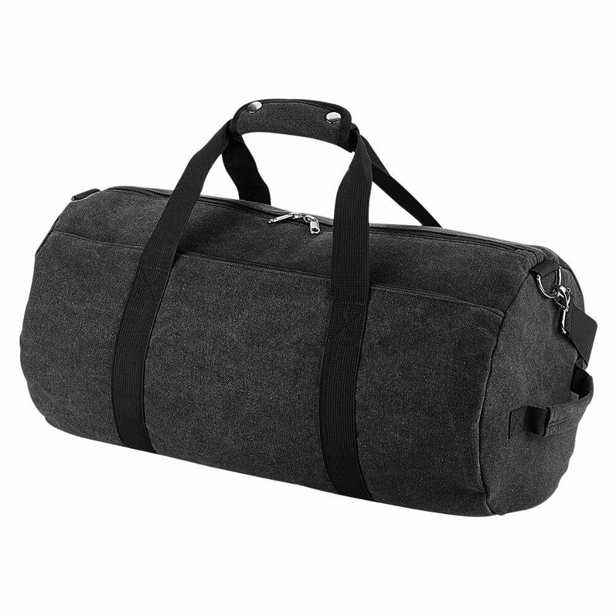The Bagbase BG655 is a black duffel bag featuring two handles, a zipper, and an adjustable shoulder strap.