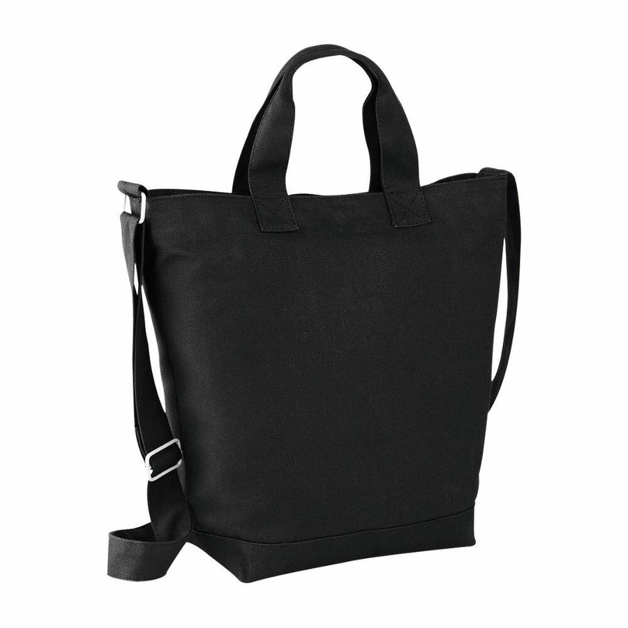 The BG673 by Bagbase is a black tote bag featuring short handles and a long adjustable shoulder strap, showcased upright against a plain background.