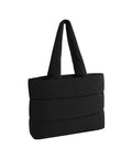 Bags: A black, rectangular quilted tote bag with a puffy look, horizontal stitching, and two wide shoulder straps. Displayed on a white background.