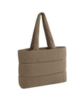 A taupe, rectangular padded bag with two wide quilted handles, displayed on a plain white background.