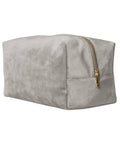 A light grey suede rectangular Bags pouch stands upright on a white background, featuring a gold zip along the top.