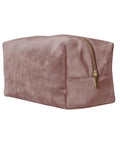 A soft pink velvet rectangular pouch from Bags, featuring a gold zip, photographed against a white background.