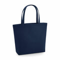 The Bagbase BG721 is a navy blue tote bag featuring two handles. It boasts a sleek, minimalist design with a rectangular shape and flat base, making it perfect for carrying various items.