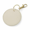 The BG745 by Bagbase is a round beige leather keychain featuring a gold ring and lobster clasp.