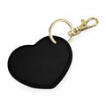 Introducing the Bagbase BG746: a heart-shaped black keychain featuring a gold ring and clasp.