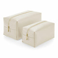 BG749 by Bagbase features a set of two beige rectangular toiletry bags with gold zippers, one larger than the other, showcased on a white background.