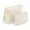 The Bagbase BG751 features two ivory-colored zippered pouches in different sizes. They boast a minimalist design with gold zippers and stand upright, highlighting their curved rectangular shape.