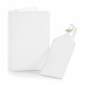 Discover the Bagbase BG755 set, featuring a white passport cover with a smooth finish and a coordinating luggage tag adorned with an elegant gold buckle for attachment. Both items showcase a simple yet sophisticated design.