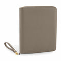 The Bagbase BG756 portfolio organizer is elegantly displayed in an upright position, showcasing its sleek, grey leather finish with a textured surface. It features a zippered closure, a convenient wrist strap, and is accented with gold-toned hardware.