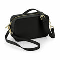 A Bagbase BG758, a black rectangular handbag featuring a detachable strap and gold zippers.