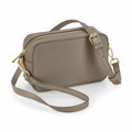 Introducing the BG758 by Bagbase, a compact taupe rectangular crossbody bag enhanced with a detachable strap and gold-tone hardware. This stylish accessory boasts a zipper closure and two adjustable strap buckles, elegantly showcased on a white background.
