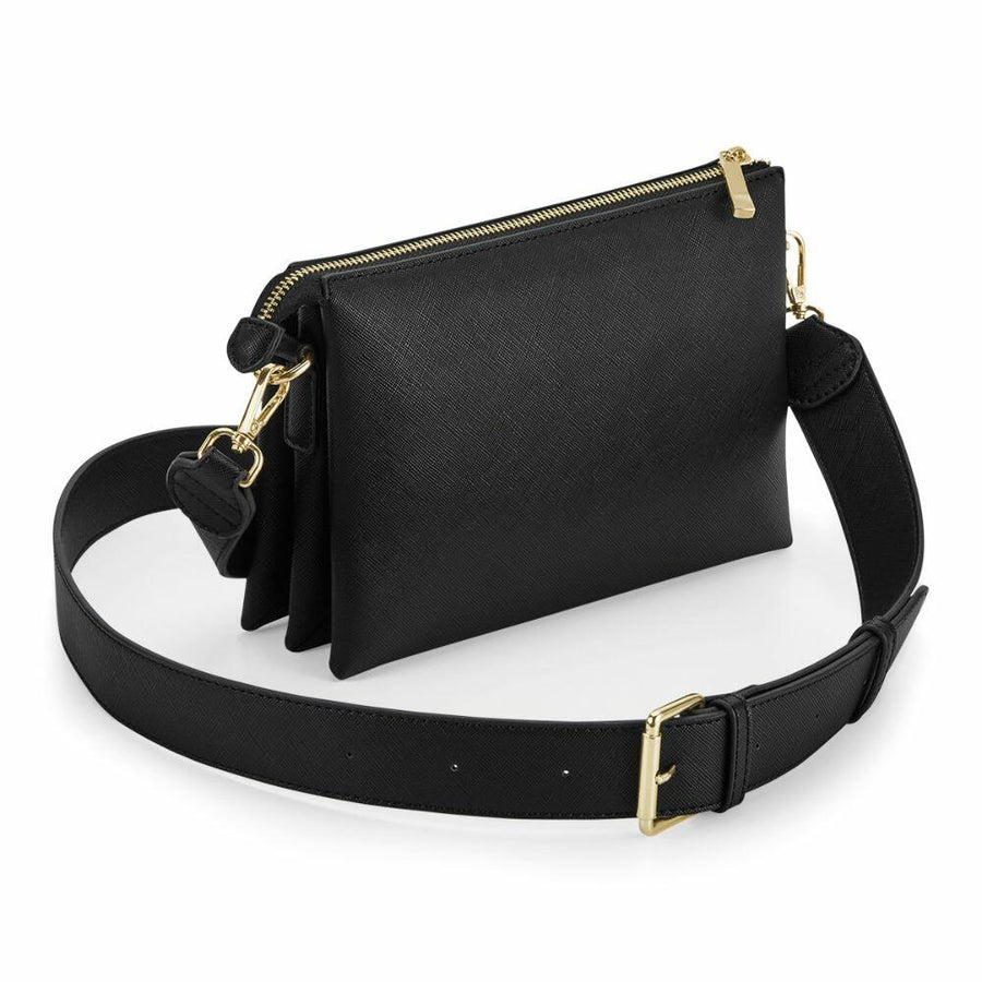 Introducing the Bagbase BG759: A black leather crossbody bag adorned with gold hardware, complete with a wide adjustable strap and a secure zippered closure.