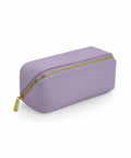 The Bagbase BG761, a rectangular pencil case in lavender, features a gold zipper and is showcased against a white background. Its surface is smooth and textured, offering ample space for storing an assortment of writing instruments.