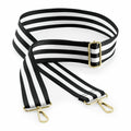 Bagbase BG765 strap in black and white stripes featuring gold clips and an adjustable buckle, laid flat.