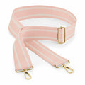 Coiled elegantly, the BG765 by Bagbase is a pink striped adjustable bag strap featuring gold-colored metal buckles and hooks. Its light pink and white stripes add a stylish touch to any accessory.