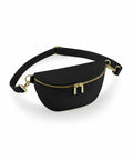 A black Bagbase BG766 waist bag featuring a gold zipper and adjustable strap, showcased against a white background.
