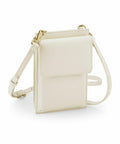 The Bagbase BG767 is a compact, cream-colored crossbody bag that features a rectangular design, gold hardware, and an adjustable strap.