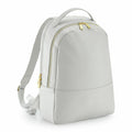 Bagbase BG768 backpack in white with gold zippers and a top handle, displayed upright against a plain background.