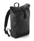 The Bagbase Tarp roll-top rucksack features a plain black design with adjustable shoulder straps, a top handle, and a black buckle fastening on the rolled flap, shown against a white background.