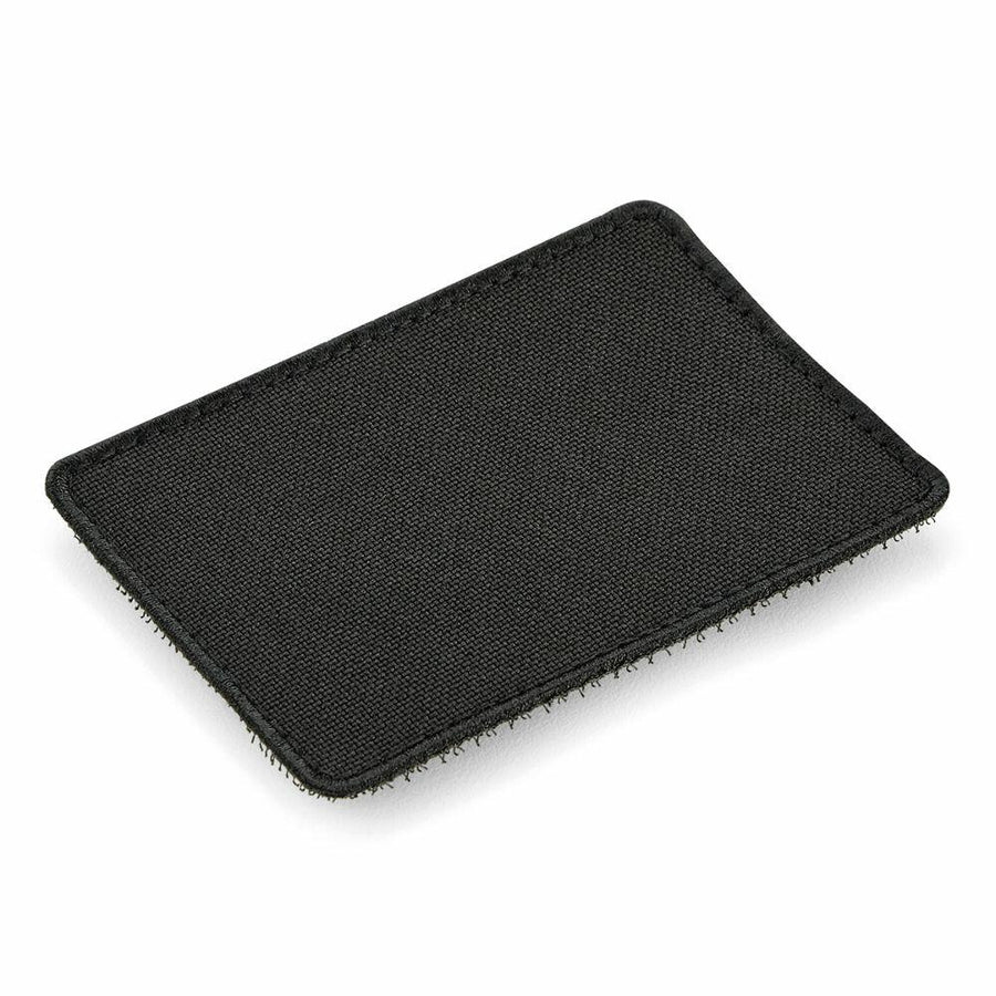 A rectangular BG840 fabric patch from Bagbase, featuring a sleek black design with rounded corners on a white background.