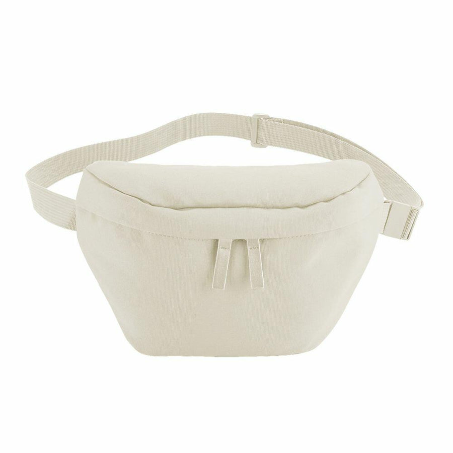 The Bagbase BG875 is a beige fanny pack featuring an adjustable strap and a zipper closure.