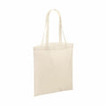 A Bagbase BG901 tote bag in a plain off-white color with two handles, displayed against a simple white background.