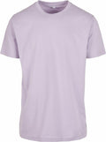 The BY004 t-shirt from Build Your Brand is shown against a white backdrop. This plain light purple shirt features a straightforward design with short sleeves and a round neckline.