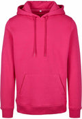 The Build Your Brand BY011 is a vibrant pink hooded sweatshirt, featuring long sleeves, a front pocket, drawstrings, and ribbed hem and cuffs. It is showcased against a white background.