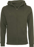 The Build Your Brand BY012 hoodie is showcased in dark green, featuring a zip-up design with long sleeves, a drawstring hood, and two front pockets. The material looks soft and comfortable, ideal for casual wear.