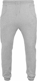 BY013 by Build Your Brand are gray sweatpants featuring an elastic waistband, drawstring, cuffs at the ankles, and side pockets.