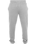 Build Your Brand's BY014 sweatpants feature a gray color with an elastic waistband and white drawstrings. They offer convenient pockets on each side and have a loose fit with slightly gathered cuffs.