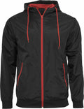 The Build Your Brand BY016 jacket is black with a red zipper and drawstrings, and it features two front pockets.