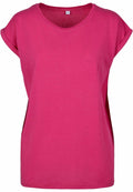 The BY021 from Build Your Brand is a plain T-shirt in a vibrant pink hue, featuring short sleeves and a round neckline. Its fabric is soft and lightweight, making it ideal for casual wear. The shirt is showcased against a white background.