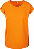 The BY021 T-shirt from Build Your Brand is shown against a white background, featuring a vibrant orange color with short sleeves. It includes a simple crew neckline and rolled cuffs, providing a casual and lively look.