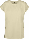 A simple T-shirt from the Build Your Brand collection, product name BY021, in a beige color with rolled-up sleeves against a white background. It features a minimalist design with a round neckline and no visible logos or patterns.