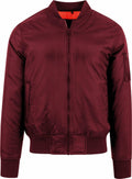 The BY030 from Build Your Brand is a maroon bomber jacket featuring a front zipper, ribbed cuffs and hem, a sleeve pocket, and a bright orange lining.