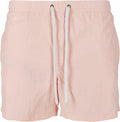 The BY050 shorts by Build Your Brand feature a light pink color, an elastic waistband, and white drawstrings, designed for a casual fit.