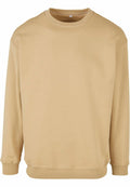 Product BY075 by Build Your Brand is a plain beige sweatshirt with a round neckline and long sleeves, displayed on a white background.