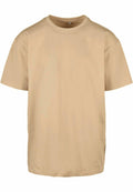 The BY102 t-shirt from Build Your Brand is displayed against a white background. This short-sleeved shirt features a round neckline, offering a simple and casual design in plain beige.