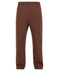 Trackwear plain brown sweatpants feature an elasticated waistband, straight legs, and a logo-free design, shown on a white background.