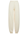 Track bottoms: Plain, cream-coloured jogger track bottoms featuring an elastic waistband and ankle cuffs, shown on a white background.